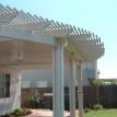 Contoured lattice surrounds solid patio cover