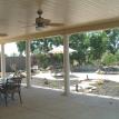 Solid Patio Cover with fans and columns.